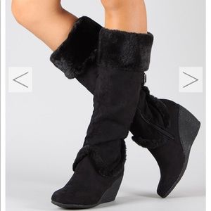 Women’s black wedge boot.